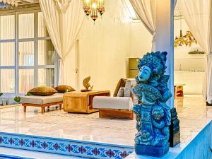 a statue in a room with a living room at Hafrana Villa by AGATA - 700sqm 2BR Villa with Private Pool & Jacuzzi in Sidemen
