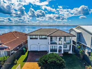 a house with a view of the water at Coastal Oasis in Toukley