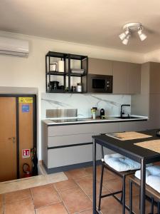 a kitchen with a sink and a counter top at AtticoCinque in Bari