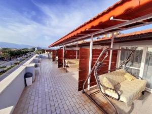 a row of benches on the roof of a building at Bluetopas Otel in İskele