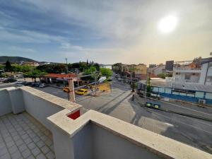 a view of a city from a balcony with a street at Bluetopas Otel in İskele