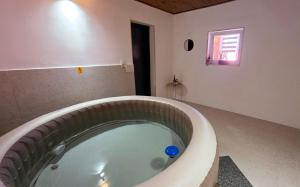 a bath tub in a room with at Apartman DIVAN in Ladimirevci