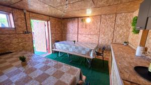 an inside view of a room with a table at Apartman DIVAN in Ladimirevci