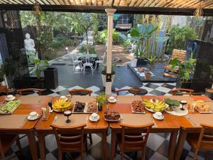 a table with bananas on it in a restaurant at Endlessblue Resort Kalametiya in Kalametiya