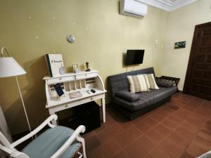 a living room with a couch and a tv at Convento de Lillo in Lillo +99 photos