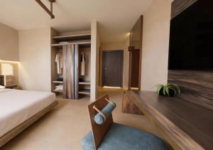 a bedroom with a bed and a wooden desk at San Francesco Heritage Hotel in Alghero +34 photos