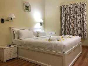 Postel nebo postele na pokoji v ubytování Daffodils Spice Court + 37 fotografií