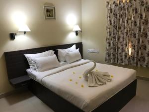 Un pat sau paturi într-o cameră la Daffodils Spice Court