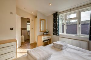 a bedroom with a white bed and a window at Field View 2 bed-No pets-Hornbeam in Eye