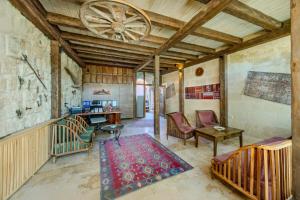a living room filled with furniture and a ceiling at The Calypso Cave in Ürgüp