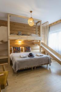 a bedroom with a bunk bed in a room at Panocek in Białka Tatrzańska