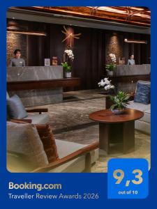 a hotel lobby with a bench and a table at HOTEL de LAGOM in Hanoi