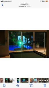 a view from the inside of a house with a window at Junior Suite with Pool View - in Port Elizabeth