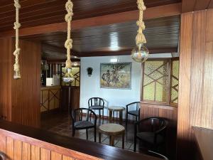 a dining room with a table and chairs at Hotel Brasa in Elvas +2 photos