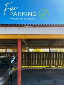 a car parked under a free parking sign at Färösund Sommar in Fårösund