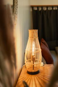 a vase sitting on a table in a living room at Thimo's Lakeview - Sunset near Interlaken in Leissigen