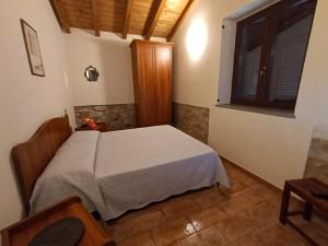 a bedroom with a white bed and a window at Ca Giacomo in Tresana +53 photos