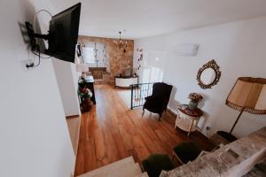 a living room with a couch and a dining room at Casa de Campo da Quinta da Pegada in Óbidos +44 photos