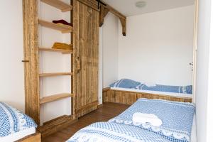 a bedroom with a bunk bed and two beds at Apartmán Marie in Mutěnice