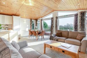 a living room with a couch and a table at Field View 2 bed-No pets-Hornbeam in Eye