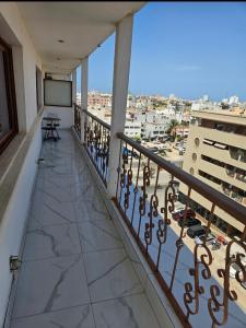 a balcony with a view of a city at Hotel liberté 6 in Dakar