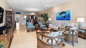 a living room with a couch and chairs at 334 Mariners Club in Key Largo