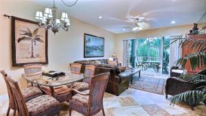 a living room with a table and a couch at 403 Mariners Club in Key Largo