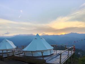 two white tents sitting on top of a mountain at Infinite horizon nan in Ban San Khet Yao