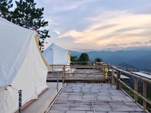 a group of tents sitting on a wooden deck at Infinite horizon nan in Ban San Khet Yao