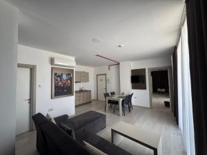a living room with a couch and a table at Alya Rooms in Lefkosa Turk