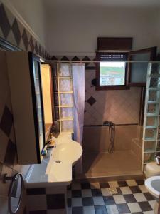 a bathroom with a sink and a shower at Sweet Home Nea Roda! in Nea Roda +22 photos