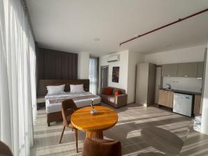 a hotel room with a bed and a table at Alya Rooms in Lefkosa Turk