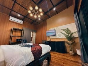 a bedroom with a large bed and a fan at Little Rock Kohjum in Ko Jum +53 photos