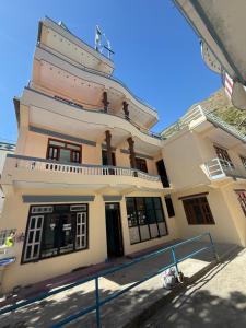 a building with a tower on top of it at Hotel River View in Syābru Bensi