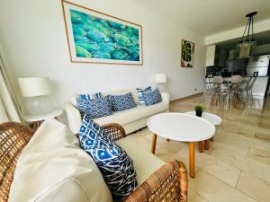 a living room with a couch and a table at Cana Rock Infinity Pool & Beach Club in Punta Cana