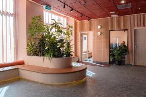an office lobby with plants in a pot at Citybox Oslo in Oslo