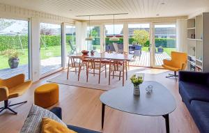 a living room with a table and chairs at Awesome Home In Haderslev With Wifi in Haderslev