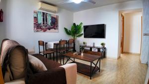 a living room with a couch and a table at Ruralux Sierra Quesada in Quesada