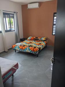 a bedroom with two beds in a room at Ambourvi in Mahajanga