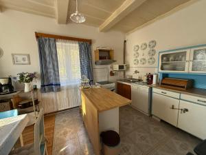 a kitchen with a sink and a counter top at Chalupa V soukromí - Chřibská in Chřibská