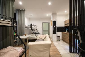 a living room with a couch and a bunk bed at Apartament Gold 3 in Złotoryja