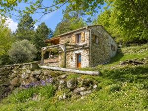 a stone house on the side of a hill at Domaine l Alba Scelta in Ucciani