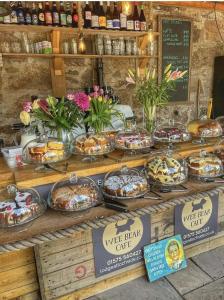 a buffet of food on display in a store at Lodge at Lochside in Bridgend of Lintrathen