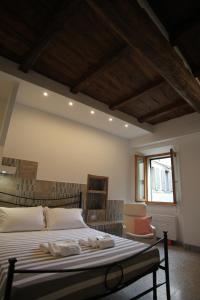 a bedroom with a large bed and a window at Casa Dante in Vitorchiano