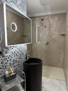 a bathroom with a shower with a sink and a toilet at Guest House Broletto in Milan +8 photos