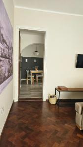 a living room with a table and a dining room at En Espejo in Mendoza