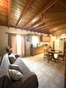 a living room with a couch and a table at Starvillas Apartments and Studios in Agia Effimia +67 photos