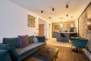 a living room with a couch and a table at Apartament Gold in Złotoryja