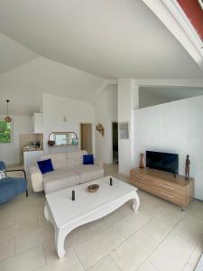 a living room with a couch and a coffee table at Budva Sky Sea - View Point in Budva