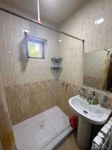 a bathroom with a sink and a mirror at Nurata Eco Guesthouse in Yukary-Ukhum +39 photos